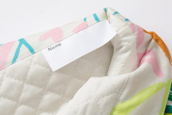 にじみ防止加工を施したお名前タグを採用した通園・通学グッズ
